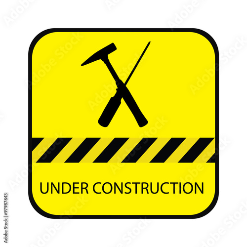 Yellow under construction road sign, with screwdriver, hammer and text under construction