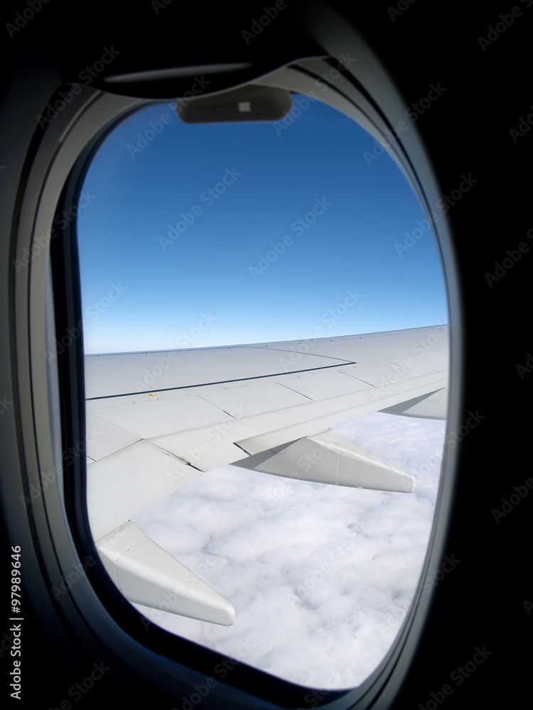 View from a window on a wing of the plane and a cloud View from a window on a wing of the plane and a cloud