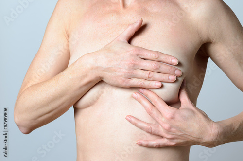 middle-aged Woman Checking Lumps on her Breast