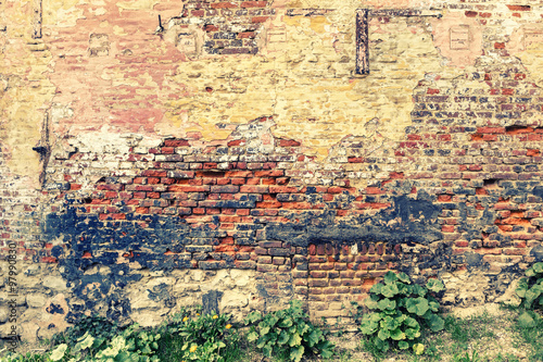 Old and cracky brick wall. Grunge background
