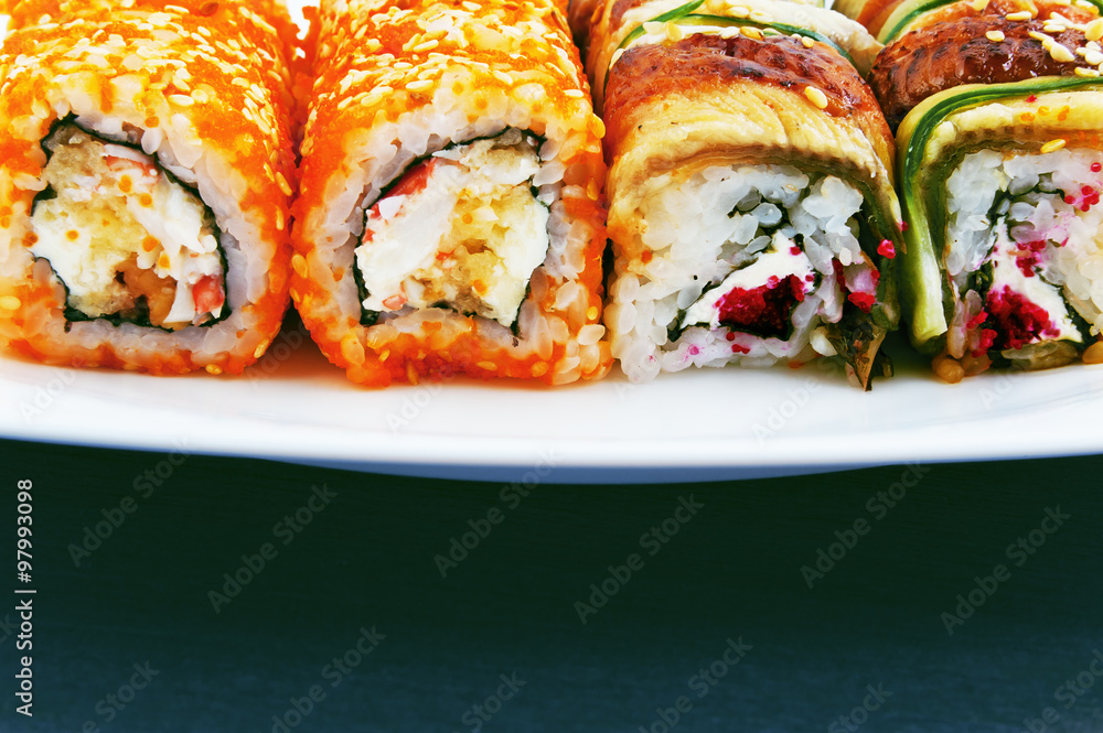 Set of rolls with crab, cream cheese and masago on a plate Set of rolls with crab, cream cheese and masago on a plate