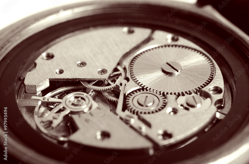 Gears old mechanical watches. Pendulum, cogs under the hood. Close up view, selective focus. Vintage toning. Gears old mechanical watches. Pendulum, cogs under the hood. Close up view, selective focus. Vintage toning.