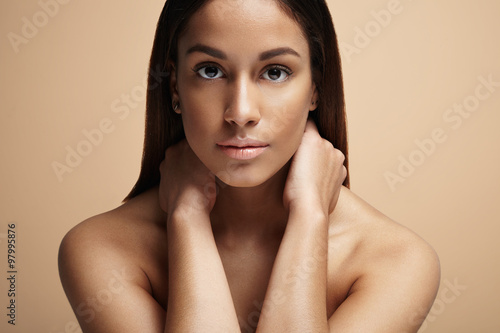 beauty spanish woman on a beige background