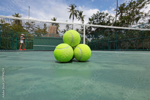 Tennis balls on court © yellowj