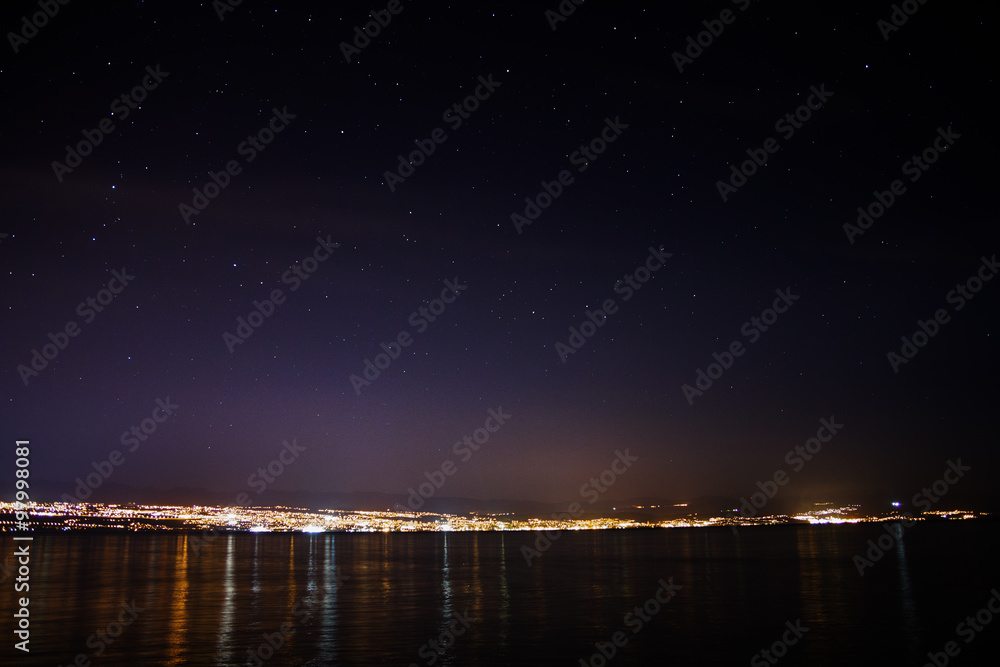 Lights of Rijeka, Croatia under night sky