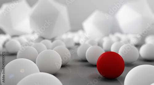 White spheres with one red on grey background