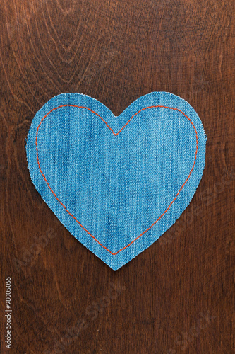 Jeans heart on wooden background