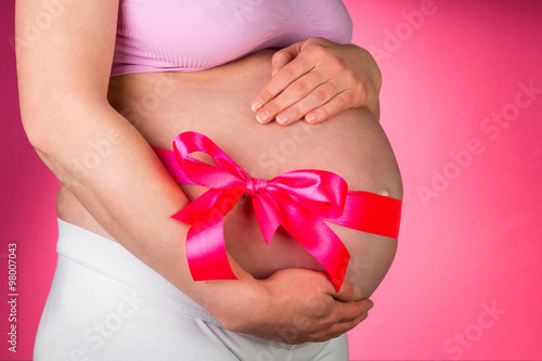 Wallpaper Mural Tummy of pregnant woman with bow Torontodigital.ca