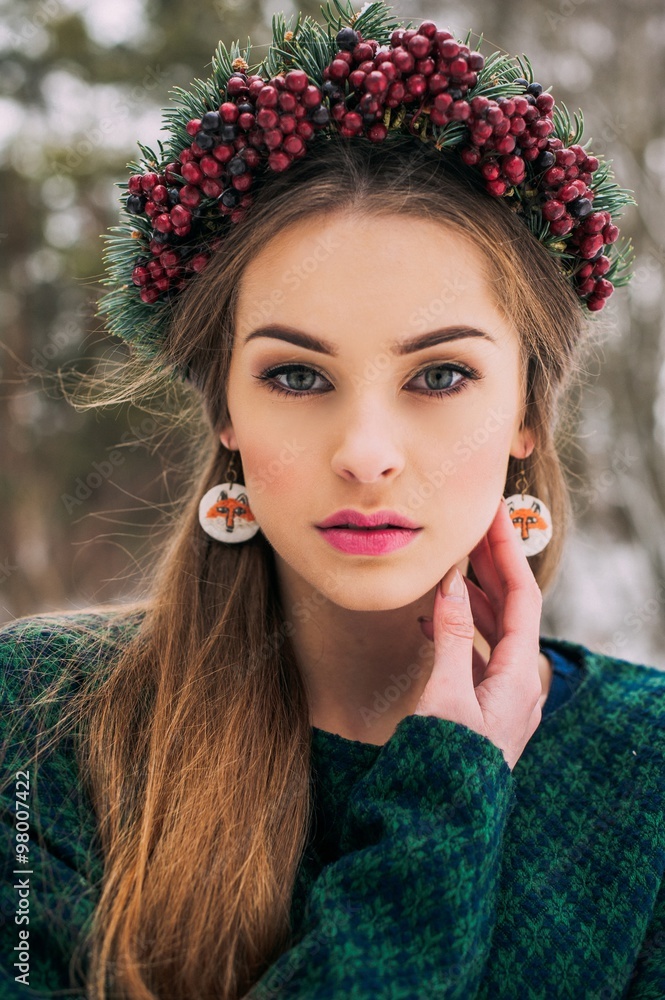 The girl in a wreath of fir branches The girl in a wreath of fir branches