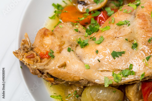 Baked chicken leg with vegetables.