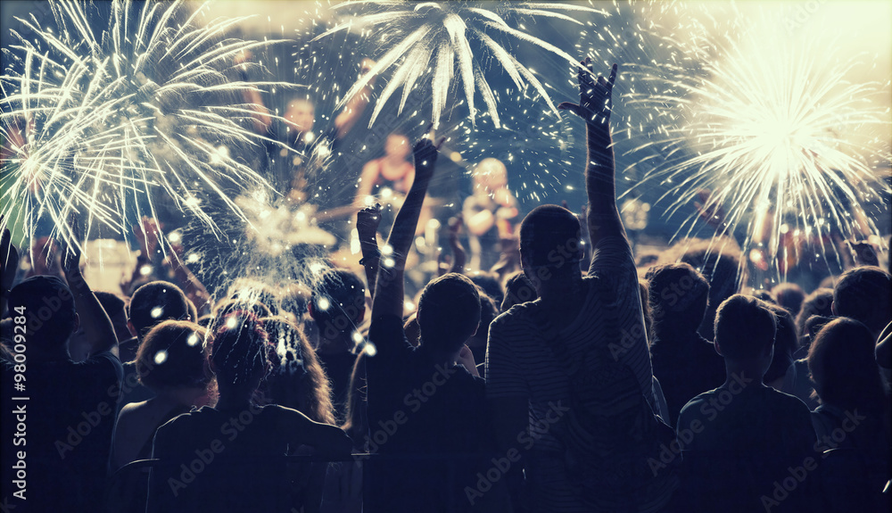 New Year concept - cheering crowd and fireworks - obrazy, fototapety, plakaty 