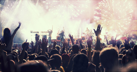 New Year concept - cheering crowd and fireworks