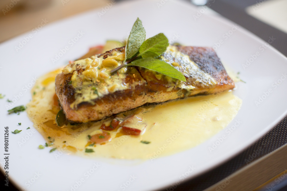 Grilled salmon with sauce and herbs Grilled salmon with sauce and herbs