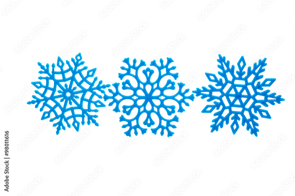 Studio close-up of a bright blue snowflake ornament Studio close-up of a bright blue snowflake ornament