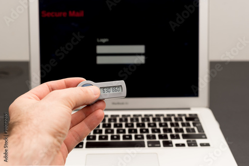 Secure token in front of a laptop