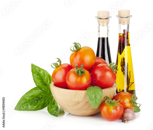Fototapeta Naklejka Na Ścianę i Meble -  Ripe tomatoes, basil, olive oil, vinegar
