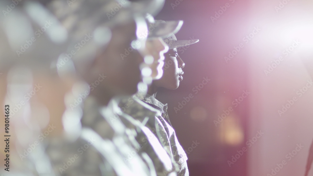 Close up on faces of mixed ethnicity female soldiers standing to attention. Close up on faces of mixed ethnicity female soldiers standing to attention.