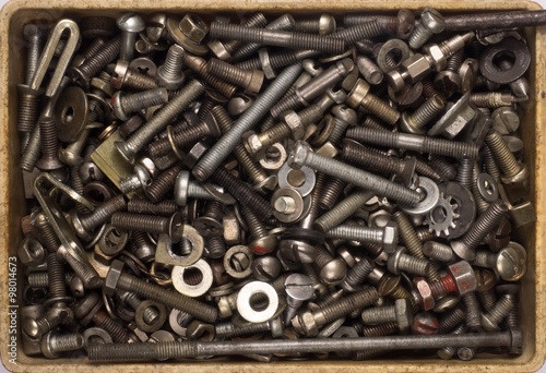 Many different screws, bolts, nuts, washers, background