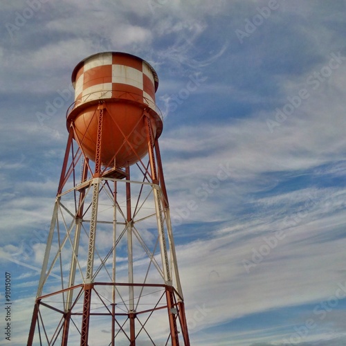 Water Tower against a Blue Sky with wispy clouds