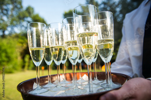 Champagne flutes prepared for a wedding reception photo