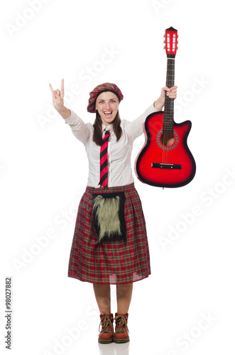 Woman in scottish clothing with guitar