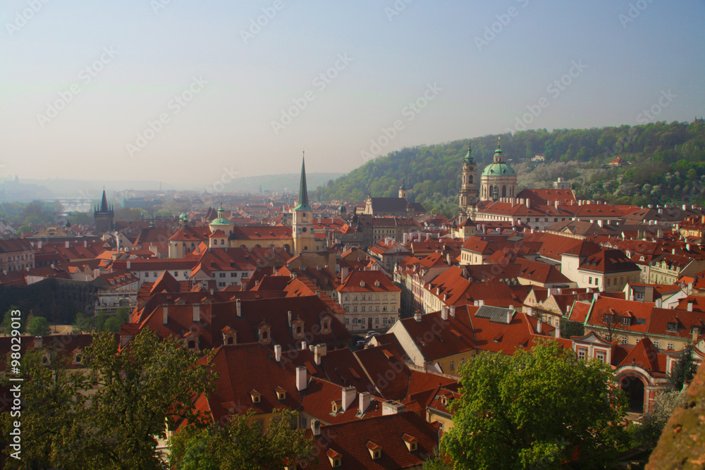 View of the old town of Prague - the red roofs and spiers of temples