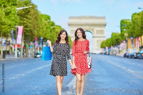 Happy twin sisters doing shopping on holidays in France © Ekaterina Pokrovsky
