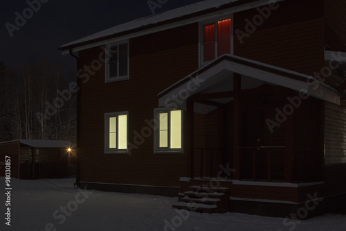 Fototapeta Naklejka Na Ścianę i Meble -  house and barn at night in snow
