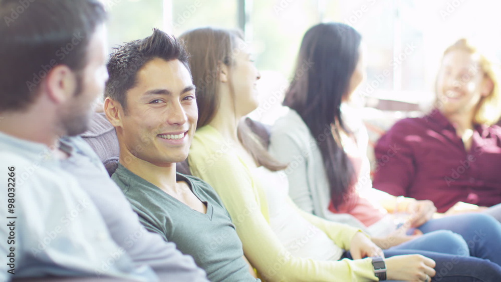 Portrait of an attractive Asian man smiling at the camera. Portrait of an attractive Asian man smiling at the camera.