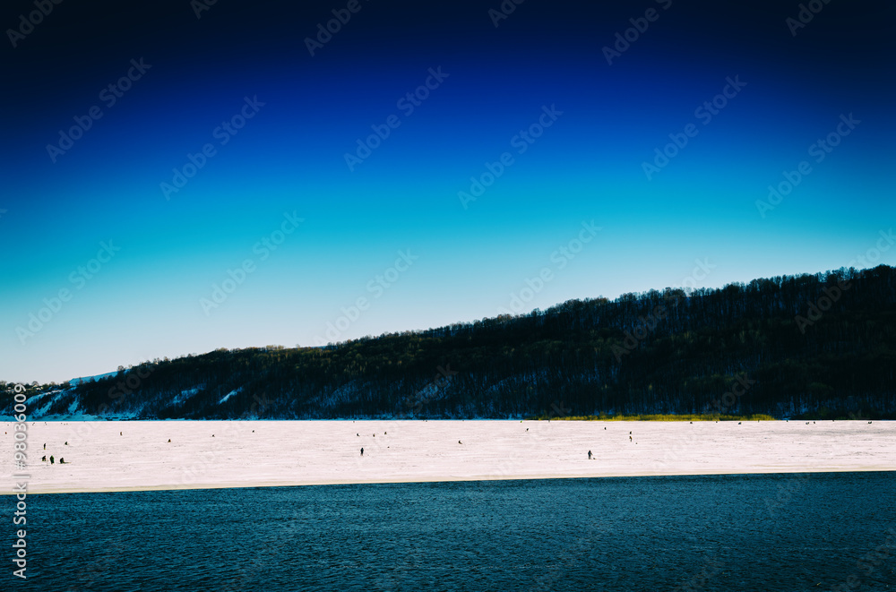 Fototapeta premium Horizontal vivid winter fishing on lake landscape background