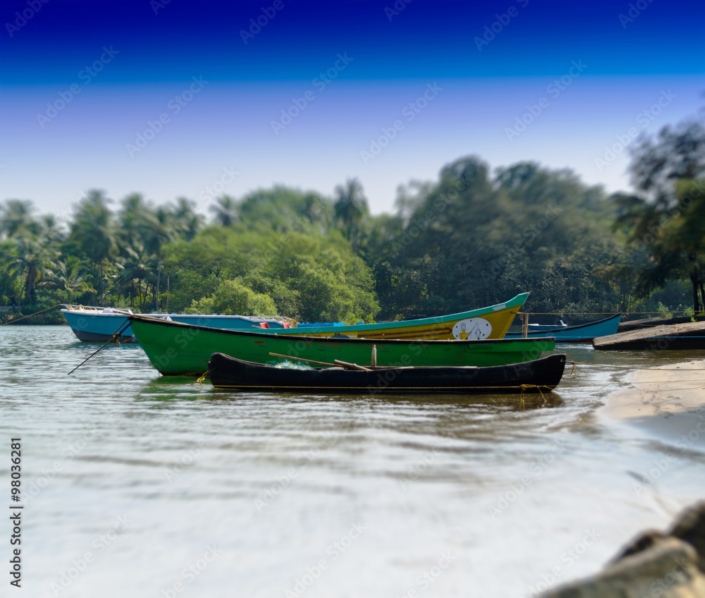 Fototapeta premium Horizontal vivid Indian boats on the beach bokeh background