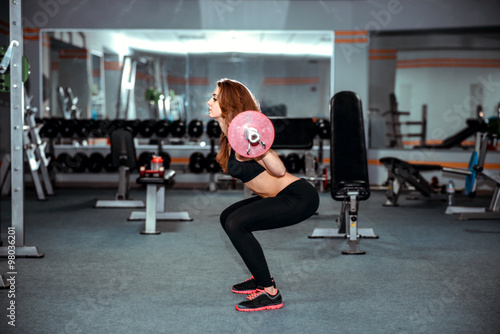 Wallpaper Mural Young pretty girl work out in the gym Torontodigital.ca
