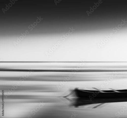 Horizontal vivid vibrant black and white travel boat blur abstra