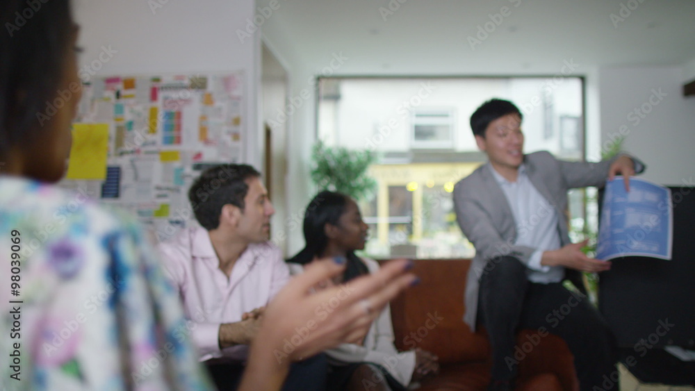 Happy creative design team clapping in a business meeting Happy creative design team clapping in a business meeting