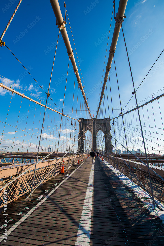 Brooklyn bridge in New York on bright summer day