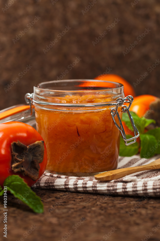 Orange Persimmon Jam with Saffron. Selective focus. Orange Persimmon Jam with Saffron. Selective focus.
