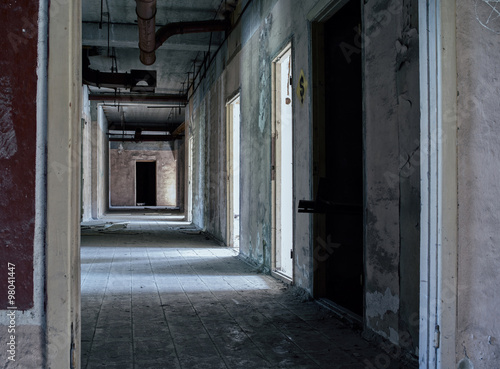 Abandoned corridors at Russian factory backdrop © spacedrone808