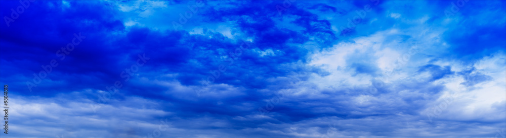 Obraz premium Horizontal wide panorama blue vivid cloudscape background backdr