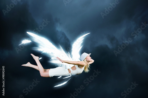 Fototapeta Naklejka Na Ścianę i Meble -  Angel girl flying high
