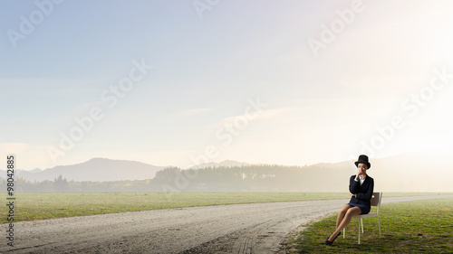 Girl in black cylinder