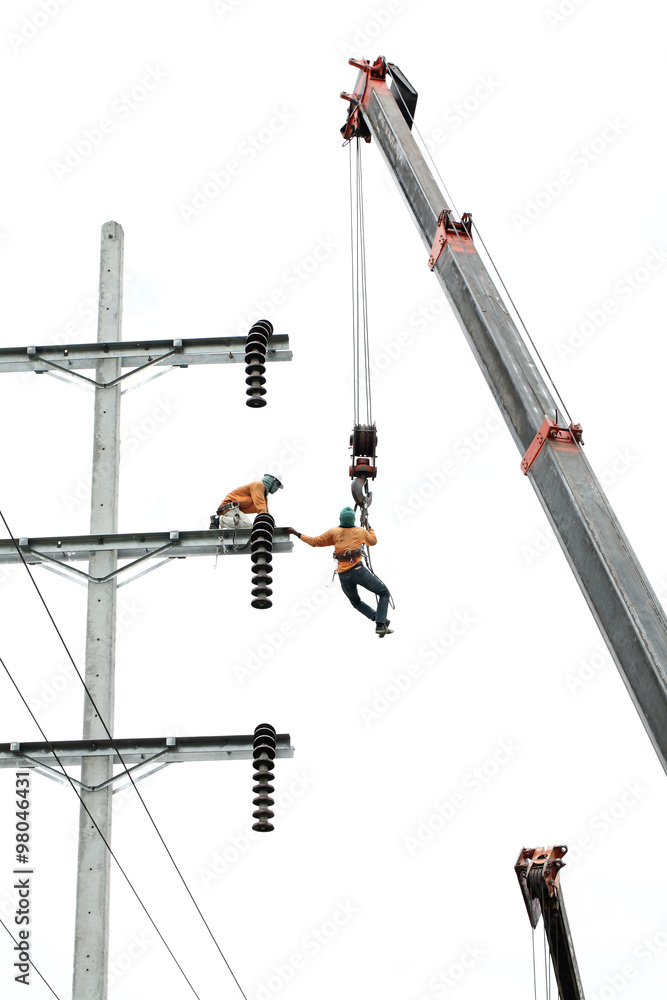 man working on electricity post man working on electricity post