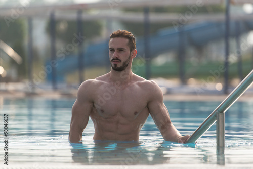 Young Looking Macho Man At Swimming Pool