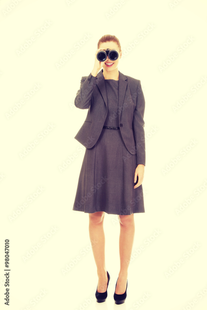 Businesswoman looking through binoculars. Businesswoman looking through binoculars.