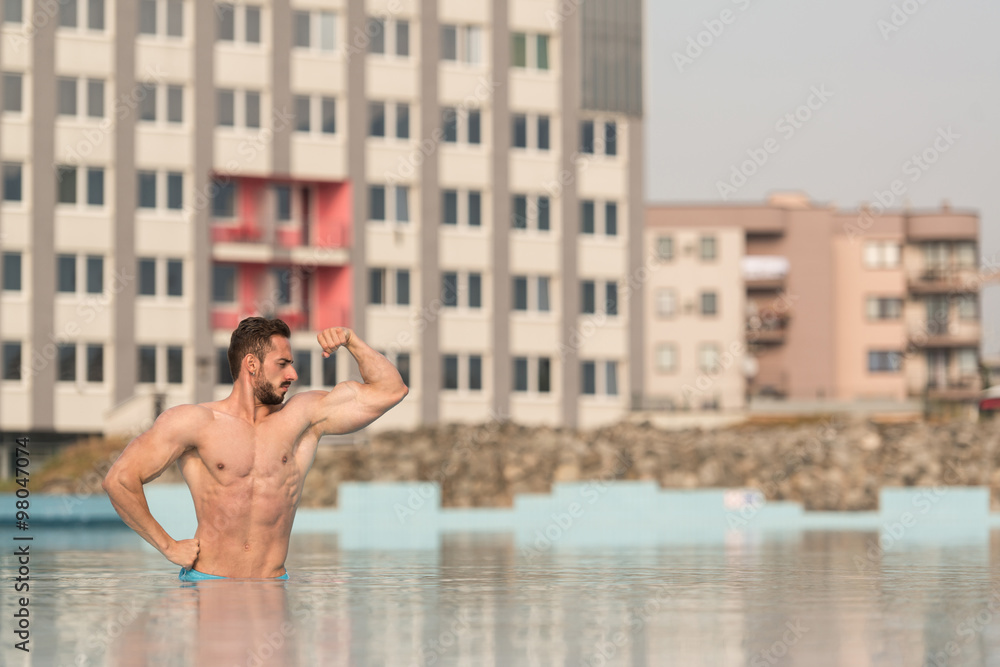 Biceps Pose In The Swimming Pool