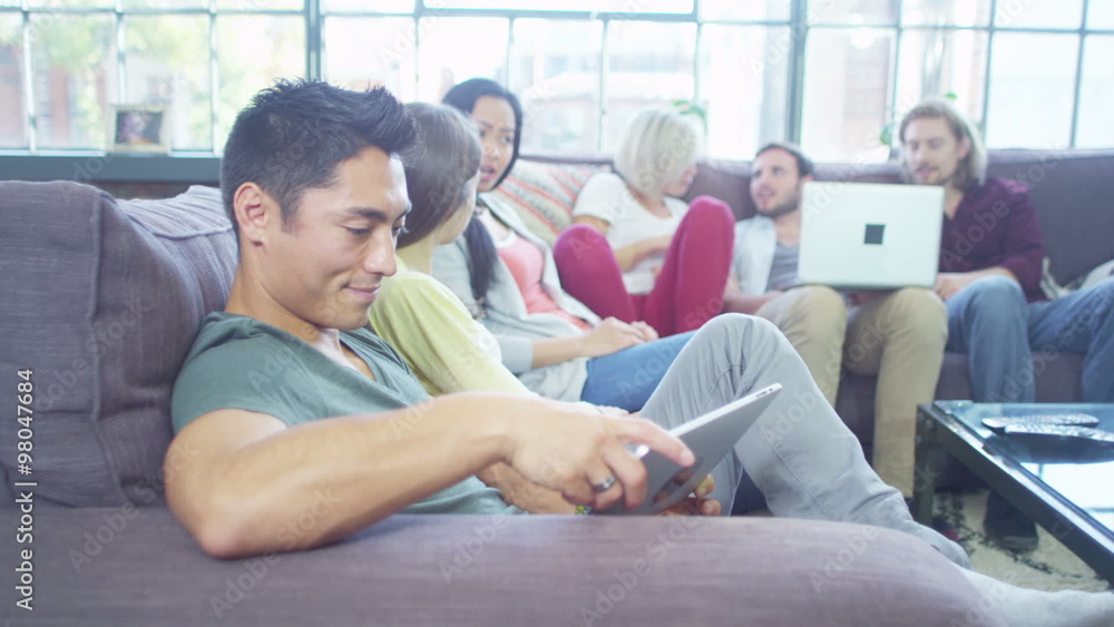 Attractive people socialise together whilst using technology Attractive people socialise together whilst using technology