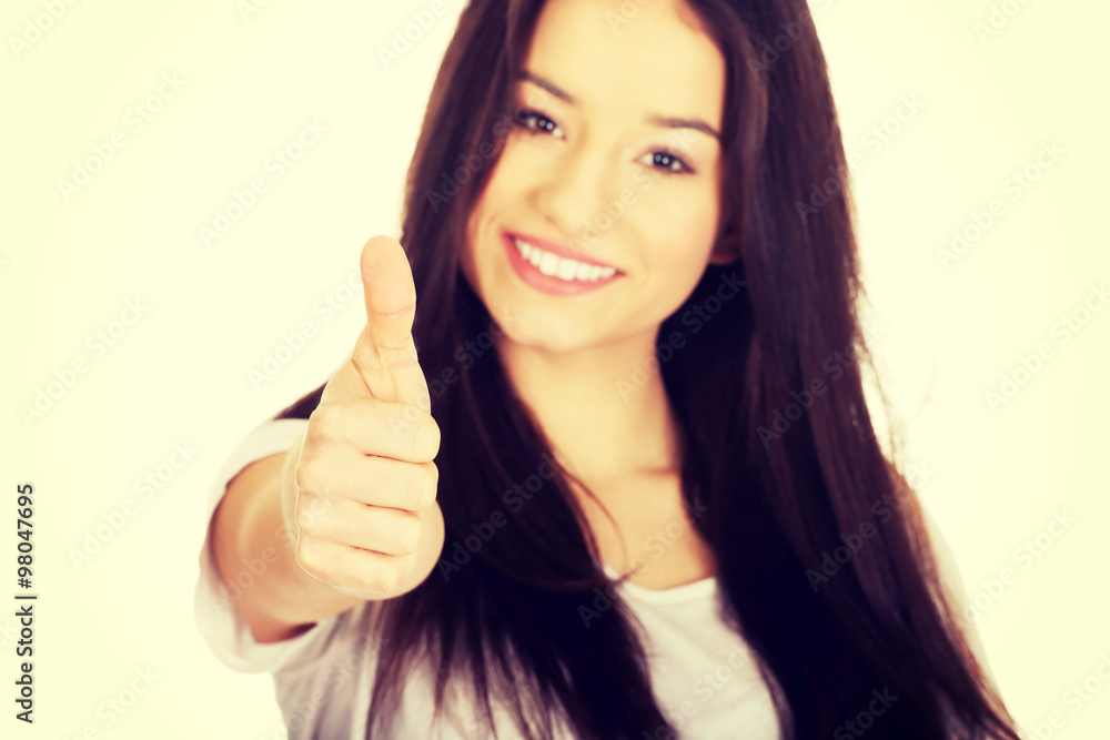 Happy woman with thumbs up.