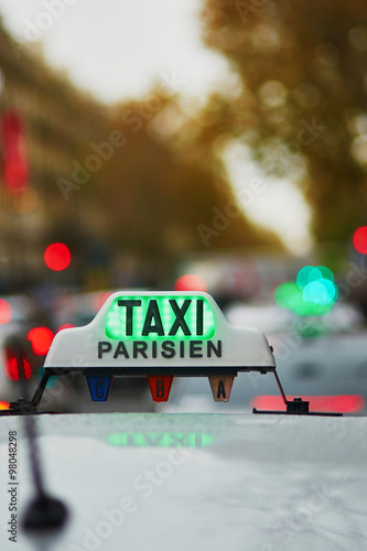 Green taxi sign in Paris