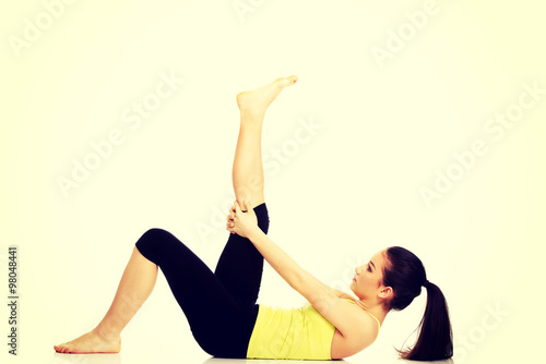 Fototapeta Naklejka Na Ścianę i Meble -  Fitness woman doing stretching exercise.