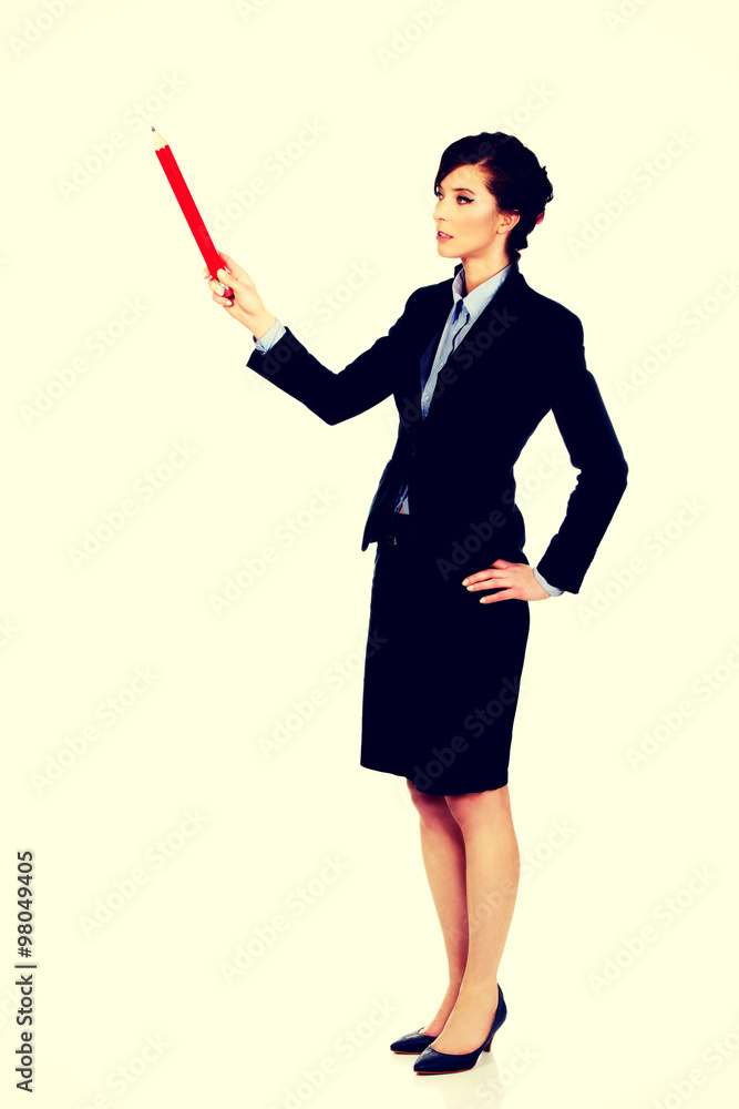 Businesswoman pointing up with pencil. Businesswoman pointing up with pencil.