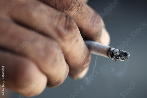 dirty hand with cigarette